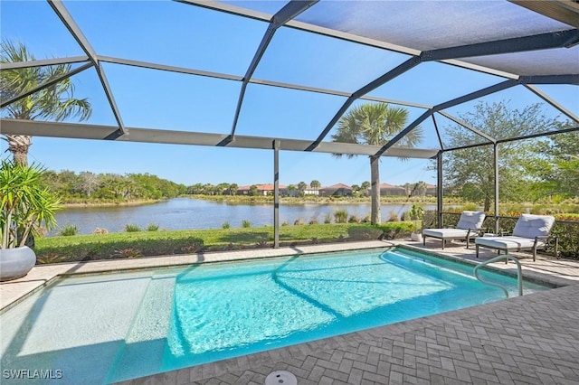 outdoor pool featuring a water view, a lanai, and a patio