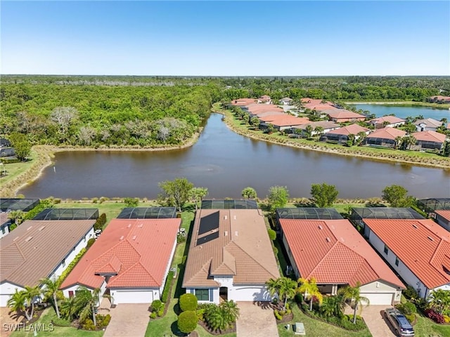 birds eye view of property with a residential view and a water view