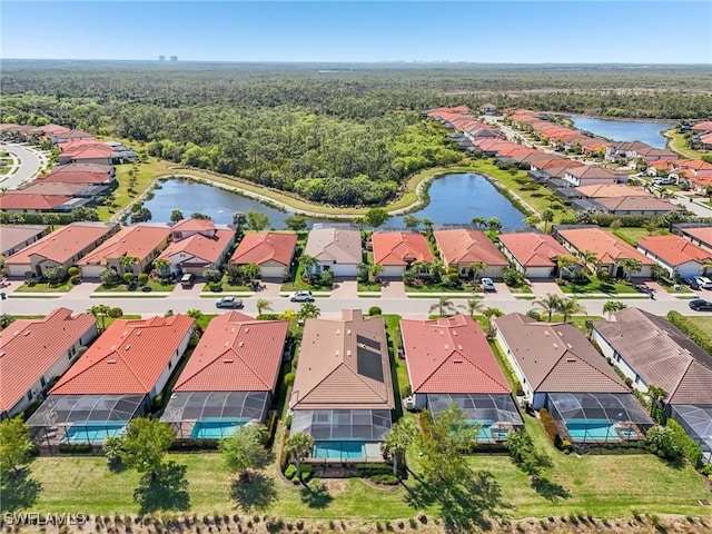 birds eye view of property with a residential view and a water view