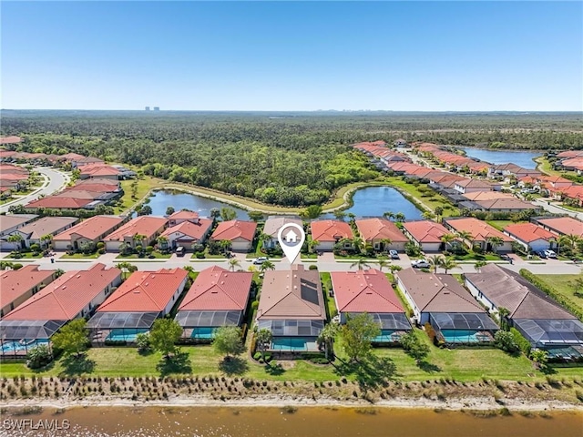 aerial view with a water view and a residential view