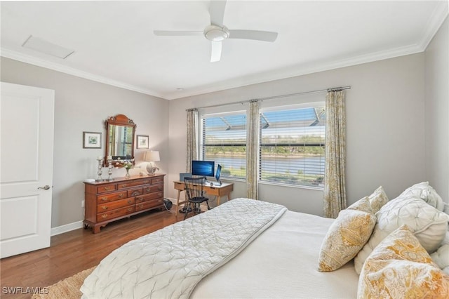 bedroom featuring crown molding, baseboards, ceiling fan, and wood finished floors