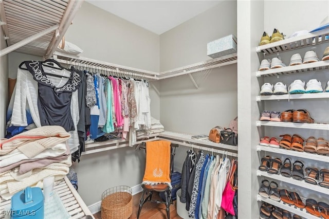 spacious closet with wood finished floors