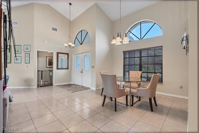 dining space with a chandelier, visible vents, and light tile patterned floors