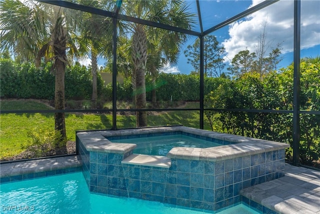 outdoor pool featuring an in ground hot tub and glass enclosure