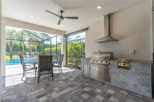 exterior space featuring a lanai, area for grilling, a grill, a pool with connected hot tub, and a ceiling fan