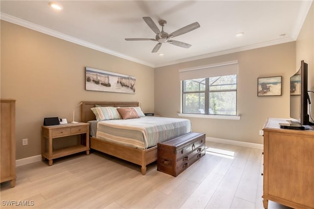 bedroom with a ceiling fan, light wood-type flooring, crown molding, and baseboards