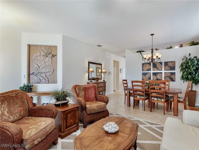 living room with light tile patterned floors, visible vents, and an inviting chandelier