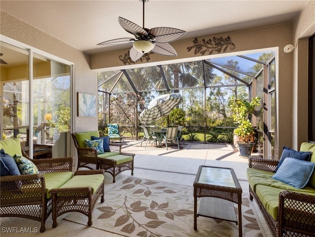 sunroom featuring a wealth of natural light and ceiling fan