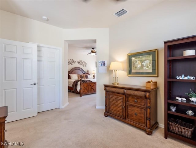 bedroom featuring light colored carpet, visible vents, and baseboards