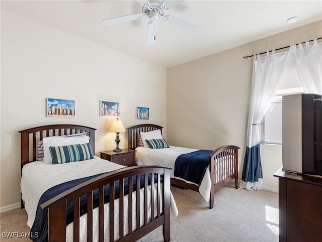 bedroom featuring carpet, baseboards, and ceiling fan