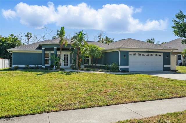 ranch-style house with stucco siding, french doors, concrete driveway, a front yard, and an attached garage