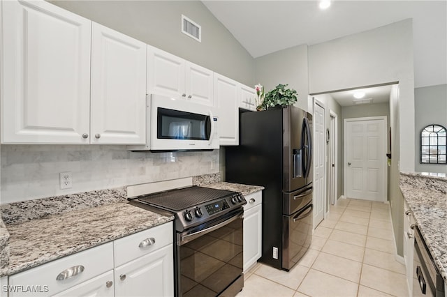 kitchen featuring visible vents, black range with electric stovetop, tasteful backsplash, white microwave, and dishwasher