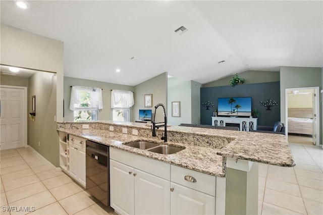 kitchen featuring black dishwasher, visible vents, light tile patterned floors, and a sink