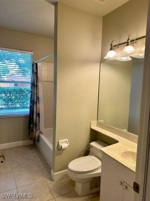 full bath with toilet, shower / bath combo with shower curtain, vanity, tile patterned flooring, and baseboards