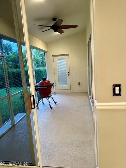 sunroom featuring a ceiling fan