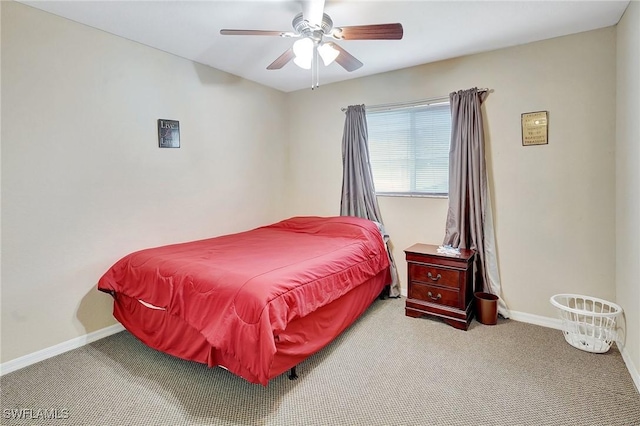 carpeted bedroom featuring a ceiling fan and baseboards