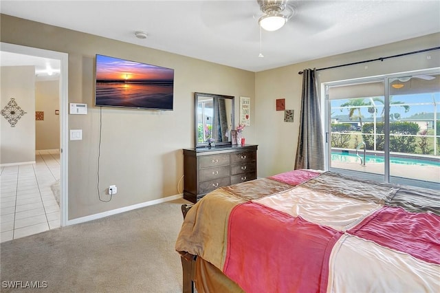 bedroom featuring light tile patterned floors, baseboards, ceiling fan, access to exterior, and light carpet