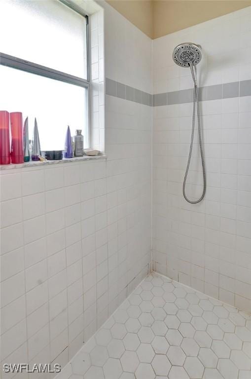 full bath featuring tiled shower