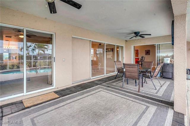 exterior space featuring outdoor dining space and ceiling fan