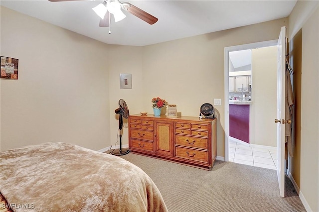 bedroom with baseboards, light colored carpet, and a ceiling fan