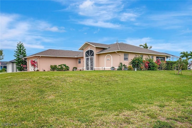 ranch-style home with stucco siding and a front yard