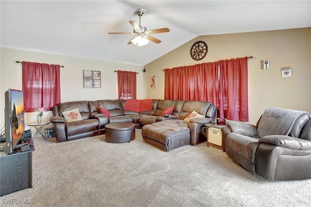 living room featuring lofted ceiling, carpet floors, and a ceiling fan