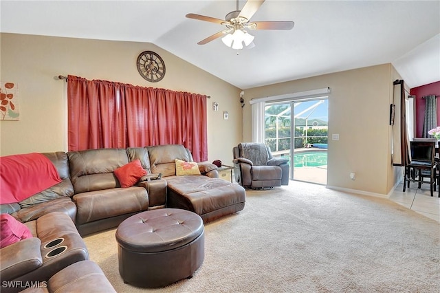 living room featuring baseboards, carpet, ceiling fan, and vaulted ceiling