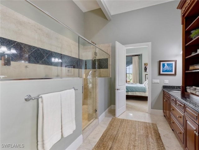 full bathroom with baseboards, vanity, ensuite bath, and a shower stall