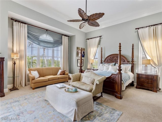 bedroom featuring crown molding, multiple windows, and carpet floors