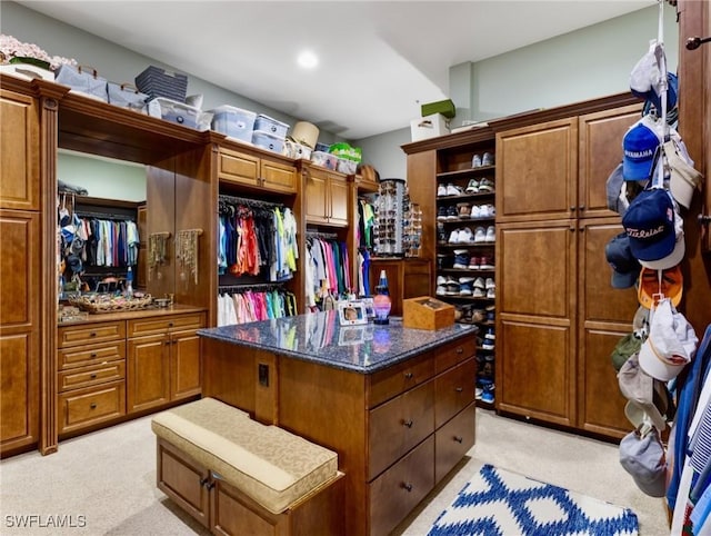 18200 Old Pelican Bay Dr, Fort Myers Beach, FL 33931 - walk in closet featuring light colored carpet