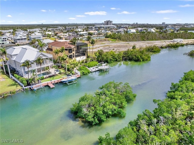 aerial view featuring a residential view and a water view