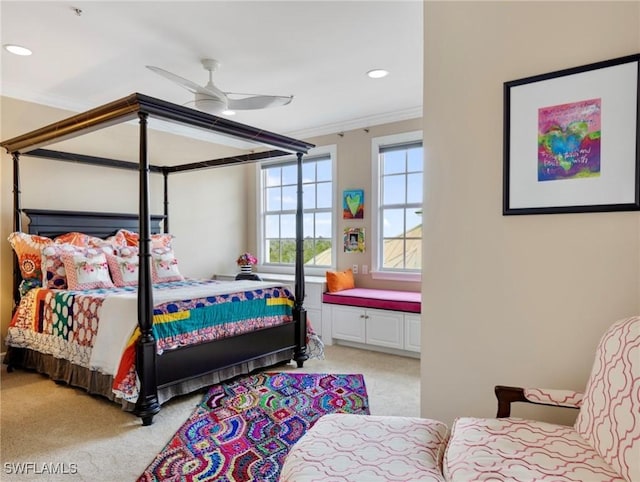 bedroom with recessed lighting, light colored carpet, ornamental molding, and a ceiling fan