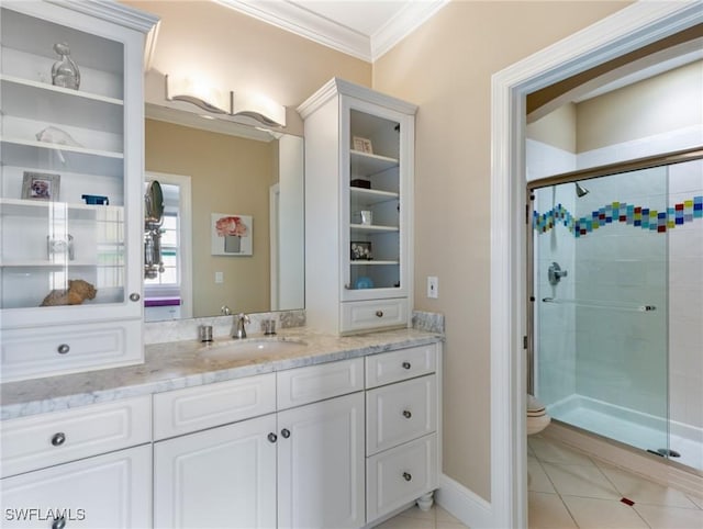 full bathroom featuring toilet, ornamental molding, a stall shower, tile patterned floors, and vanity