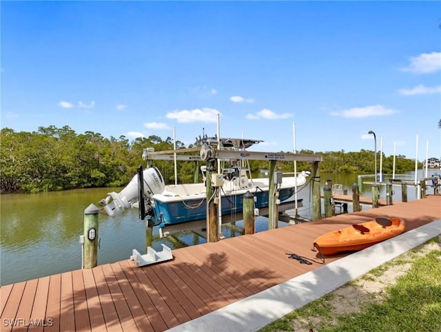 dock area featuring a water view and boat lift