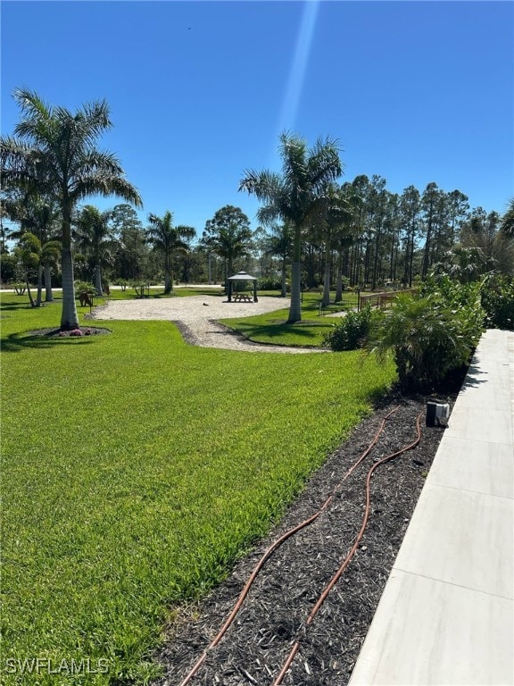 view of home's community featuring a lawn and a gazebo