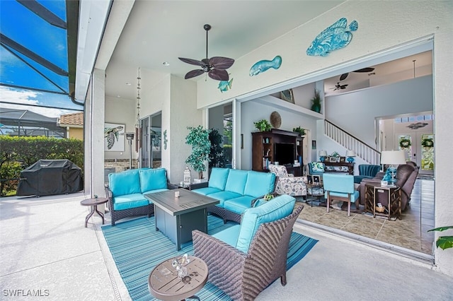 view of patio featuring an outdoor living space, a lanai, a grill, and ceiling fan