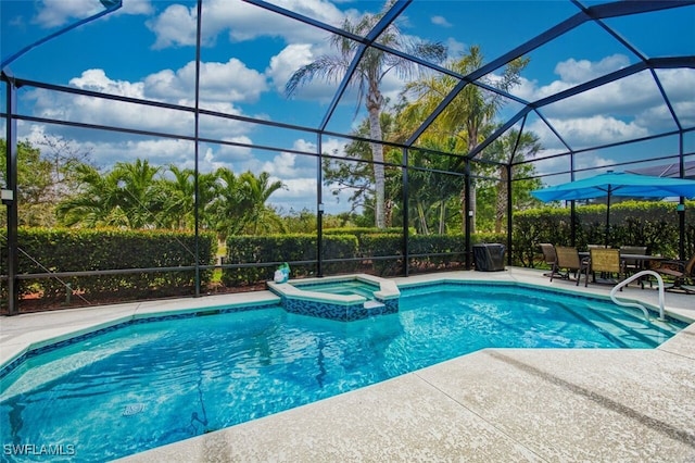 view of pool with a patio, a pool with connected hot tub, and a lanai