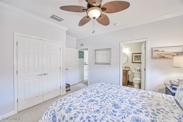 bedroom with light colored carpet, visible vents, a closet, and ornamental molding