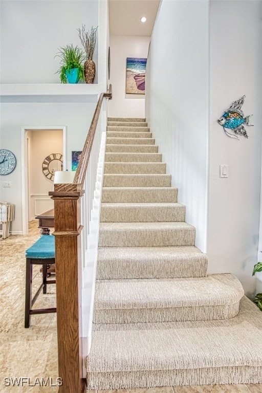 stairs featuring recessed lighting