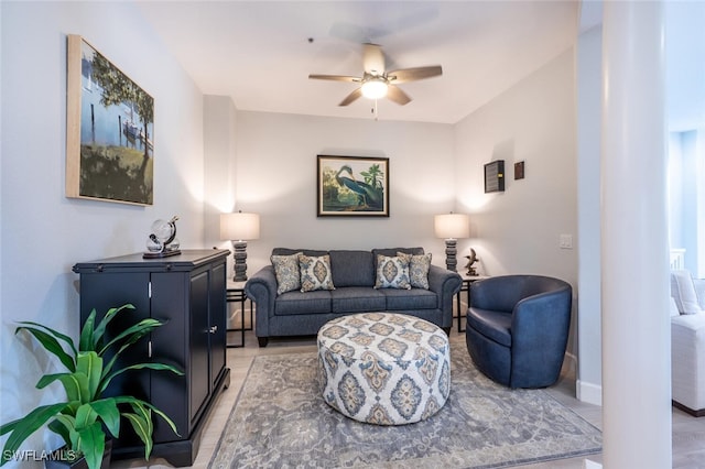 living area with a ceiling fan