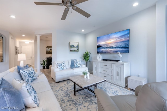 living room with ceiling fan, decorative columns, and recessed lighting