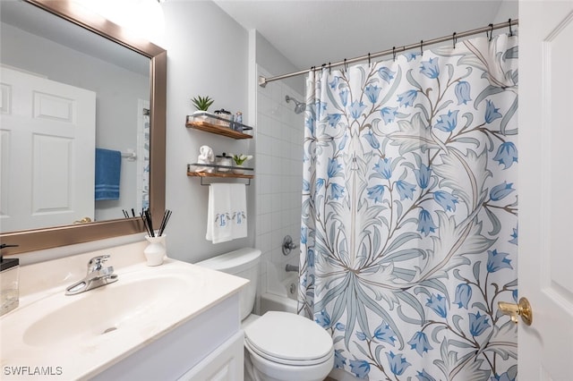 full bathroom with shower / bath combo, vanity, and toilet