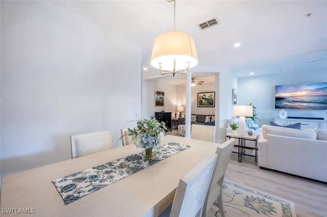 dining room with light wood finished floors, ceiling fan, visible vents, and recessed lighting