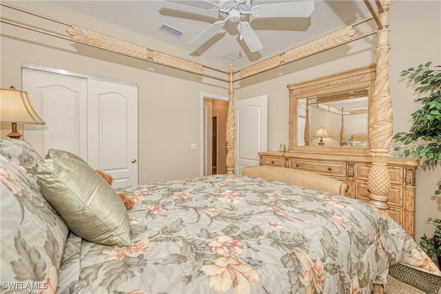 bedroom with visible vents, a closet, and ceiling fan