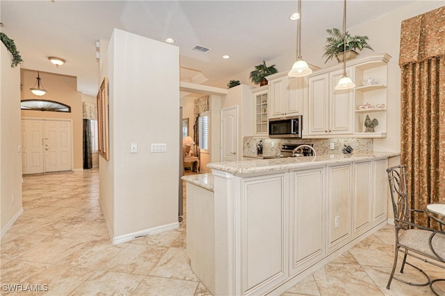 kitchen featuring tasteful backsplash, visible vents, light stone counters, stainless steel appliances, and open shelves