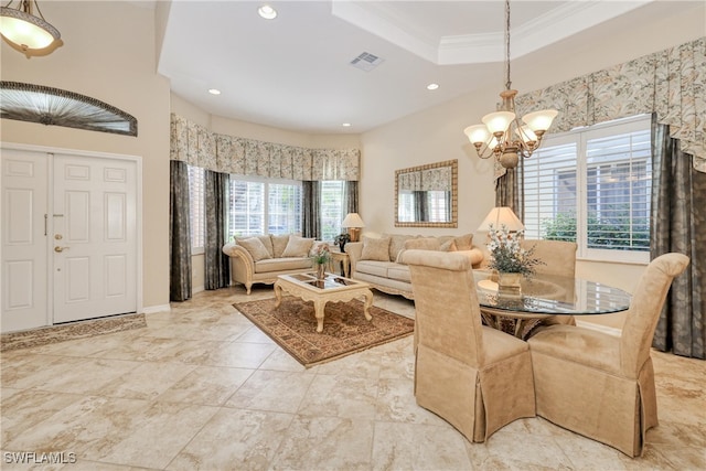 dining area with an inviting chandelier, a tray ceiling, recessed lighting, and visible vents