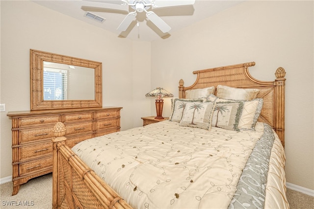 bedroom with visible vents, carpet floors, baseboards, and ceiling fan