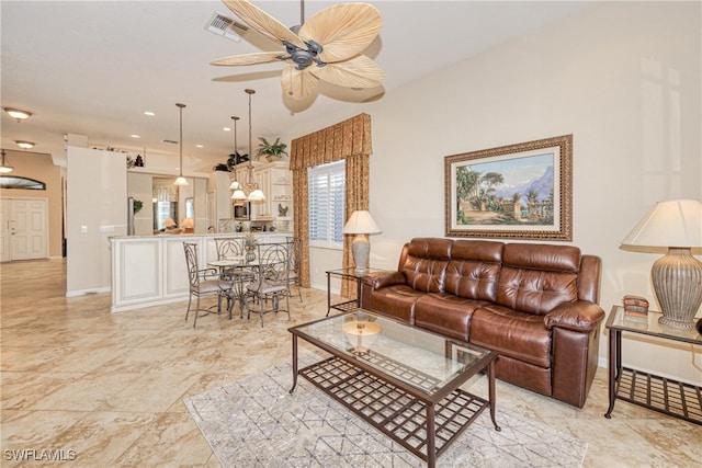 living area with a ceiling fan, visible vents, baseboards, recessed lighting, and marble finish floor