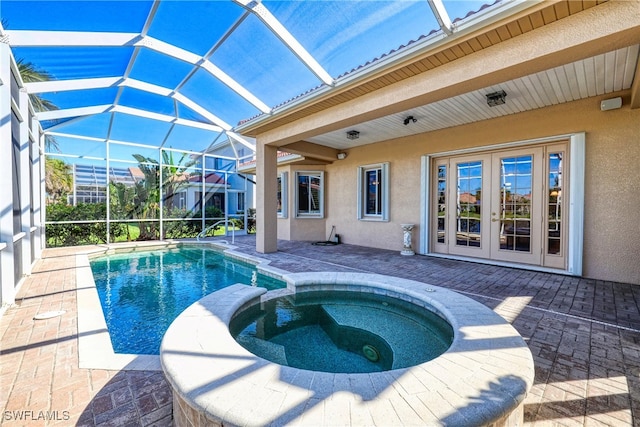 view of swimming pool featuring a lanai, french doors, a patio area, and a pool with connected hot tub