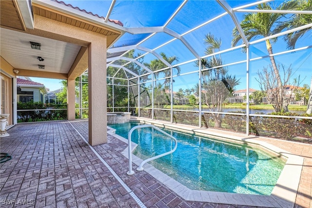 view of pool with a patio and a lanai